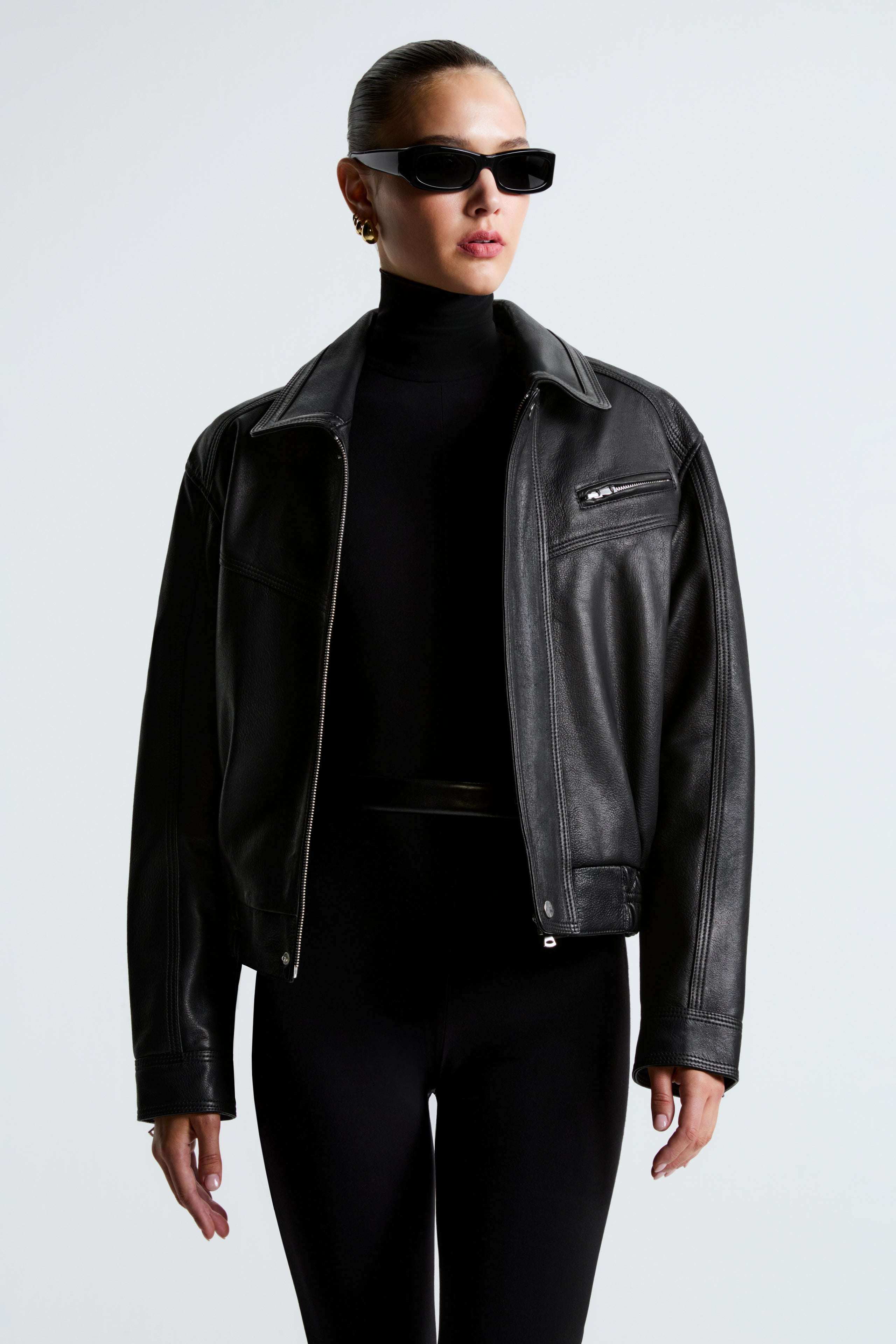 Model is wearing the Nour Hammour Clint Black Utilitarian Leather Jacket - Close Up Open