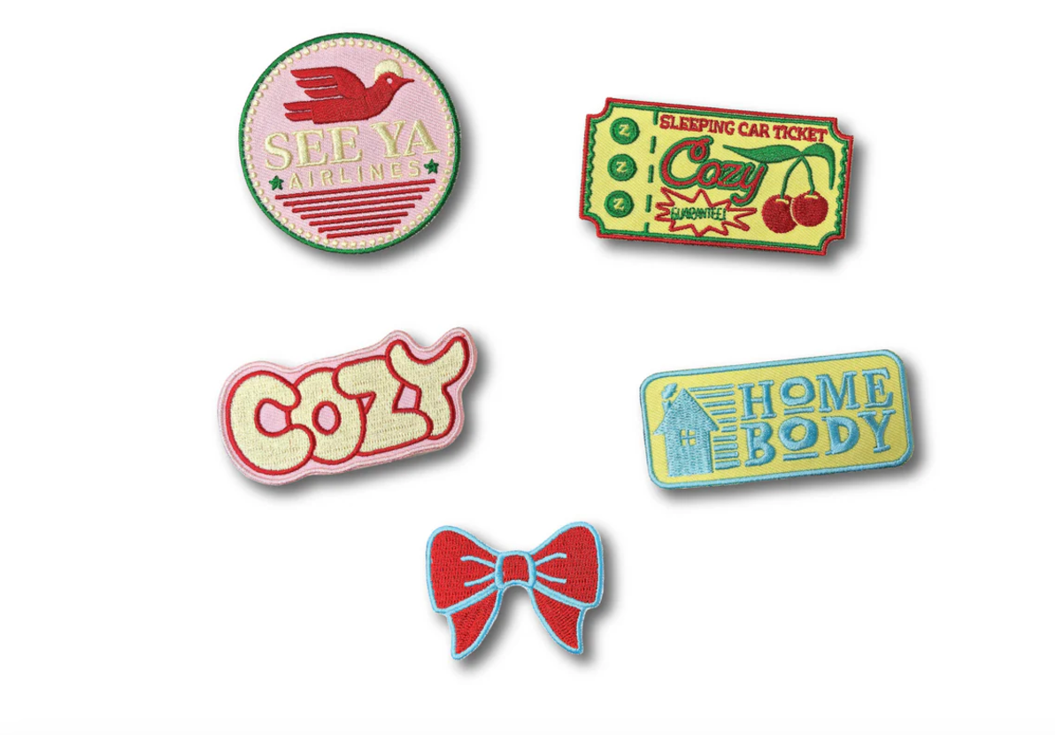 Cute embroidered patches in pinks, reds, greens, and blues.
