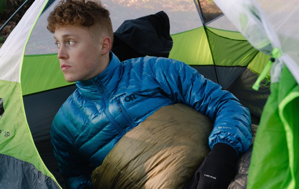 wearing down jacket in a camp