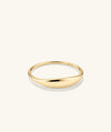 Slim Signet Ring: A handcrafted 14k gold ring with a dainty, subtle bezel surface, suitable for engraving up to seven letters.