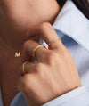 Person wearing Diamonds Open Ring with bezel-set 0.03 carat diamonds, showcasing an elegant open design ideal for stacking with other rings.