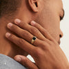 Black Onyx Square Signet Ring on a man's hand, highlighting the intricate design and elegance of the ring against the skin.