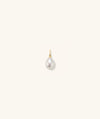 Organic Pearl Charm: A close-up of a single, perfectly imperfect pearl earring on a white background, designed to complement any outfit.
