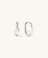 Dôme Figure Pearl Hoops featuring interwoven pearls of varying sizes on elegant hoops, ideal for versatile styling at any occasion.