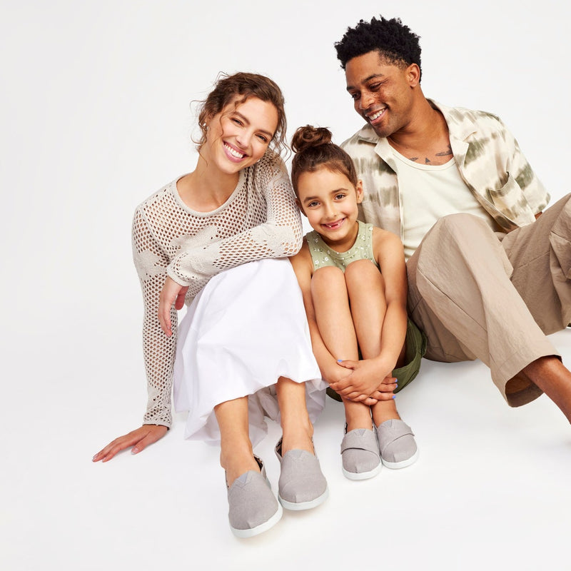 Alpargata Plus In Grey Canvas On Model Sitting With Daughter Also Wearing Alpargata Slip On Shoes Alpargata Plus In Grey Canvas On Model Sitting With Daughter Also Wearing Alpargata Slip On Shoes