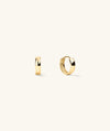 Gold Huggie Hoops, formerly Bold Hoops, shown in close-up, highlighting their stylish design and elegant craftsmanship. Perfect for elevating any outfit.