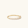 Baguette Diamond Half Eternity Band featuring eight baguette diamonds set in a timeless gold band.