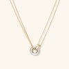 Linked Two-Tone Necklace featuring two interlinked rings on a gold chain, symbolizing strong personal bonds, handcrafted in sterling silver and gold vermeil.