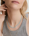 Anya Turquoise Beaded Necklace showcasing vibrant, lightweight beads, ideal for layering over casual or swimwear for a tropical-inspired statement look.