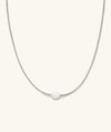Mia Slider Pearl Necklace with a moving pearl on a woven foxtail chain, designed for movement and elegance at events.