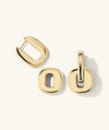 A pair of gold Stevie Hoops earrings with interchangeable, reversible links for customizable looks.