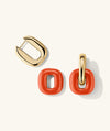 Stevie Hoops earrings featuring interchangeable and reversible red and gold rings, designed for versatile styling.
