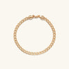 Flat Curb Chain Bracelet with a clasp, designed for everyday wear, enhancing any outfit with its elegant gold chain link.