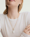 Isabel Baroque Pearl Charm with an irregular, oversized shape, designed to hook onto necklaces or hoops for a touch of salt air elegance.