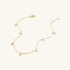 Dot Chain Anklet: A 14k gold anklet featuring small, delicate circles, ideal for stacking and daily wear. Perfect handcrafted piece for your jewelry collection.