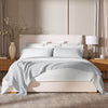 Lifestyle image of bed made with Waffle Bed Blanket in Sky
