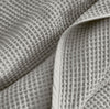 Detail image of bed made with Waffle Bed Blanket in Pewter