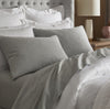 Lifestyle image of bed made with Sheet Set in Heathered Grey