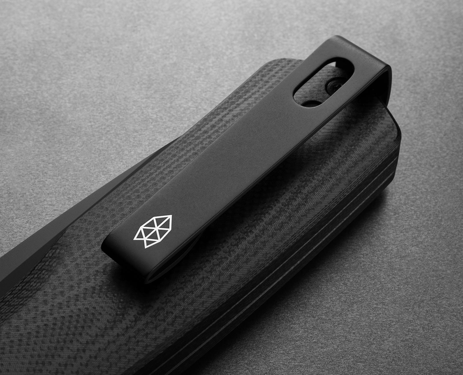 The pocket clip of the Carter EDC pocket knife in all black.